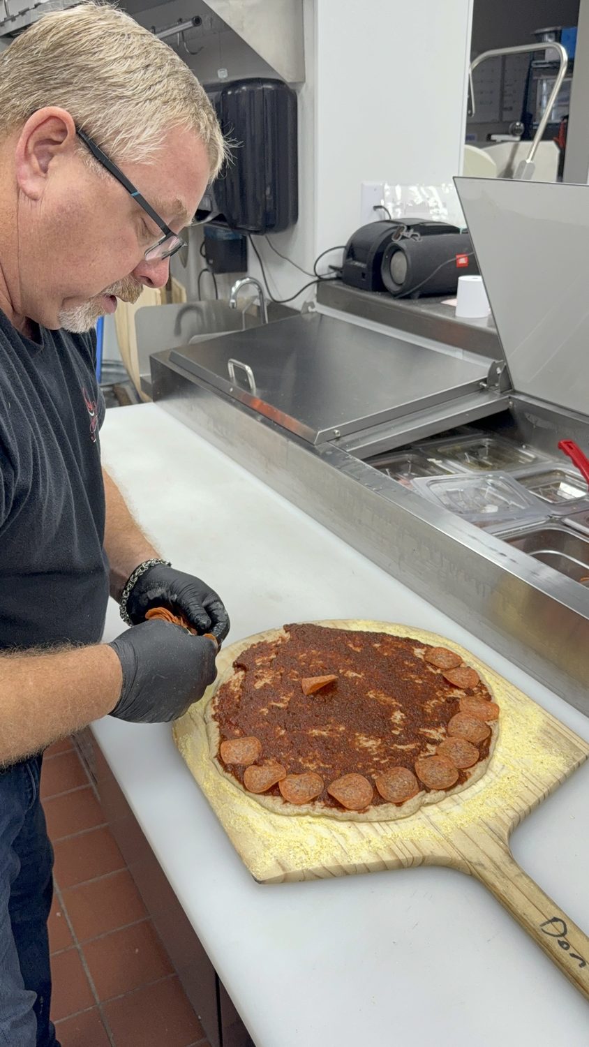 Building a pizza in the winery kitchen
